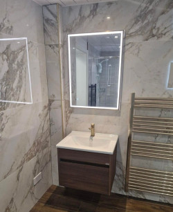 New range of brushed brass with Spanish 600x1200 porcelain tile and Merlyn full  frame wet room panel fitted into renovated Dublin bathroom by A&R Bathrooms, Ireland