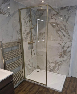 New range of brushed brass with Spanish 600x1200 porcelain tile  and Merlyn full  frame wet room panel fitted into renovated Dublin bathroom by A&R Bathrooms